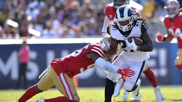 Los Angeles Rams running back Darrell Henderson (27) is tackled by San Francisco 49ers middle linebacker Kwon Alexander (56)